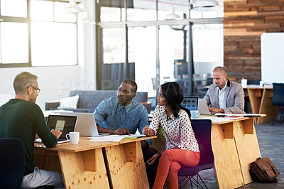 Buy stock photo Shot of a diverse group of colleagues working in an office