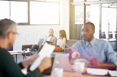 Buy stock photo Shot of individual businesspeople working in an open plan office