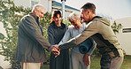 Garden, senior people and hands with huddle for fitness, support and celebration together. Backyard, retirement and friends with stack for solidarity, exercise goal or motivation with wellness team