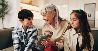 Buy stock photo Happy, toys and grandmother with children on sofa for bonding, love and connection for visit. Family, relationship and kids with grandma for conversation, care and learning with elephant on weekend