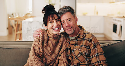 Buy stock photo Portrait, couple and relax in home with hug, love and unwind for bonding together in lounge. Smile, mature people and rest on couch with embrace, partner affection and weekend for marriage connection