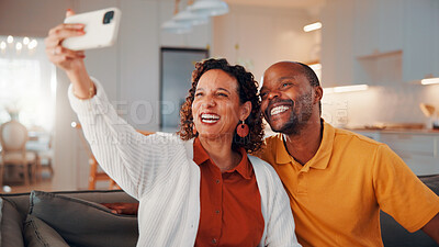 Buy stock photo Happy, selfie and mature couple in home with love, social media post and bonding together on weekend. Married, African people and photography in living room with smile, care or romantic relationship.