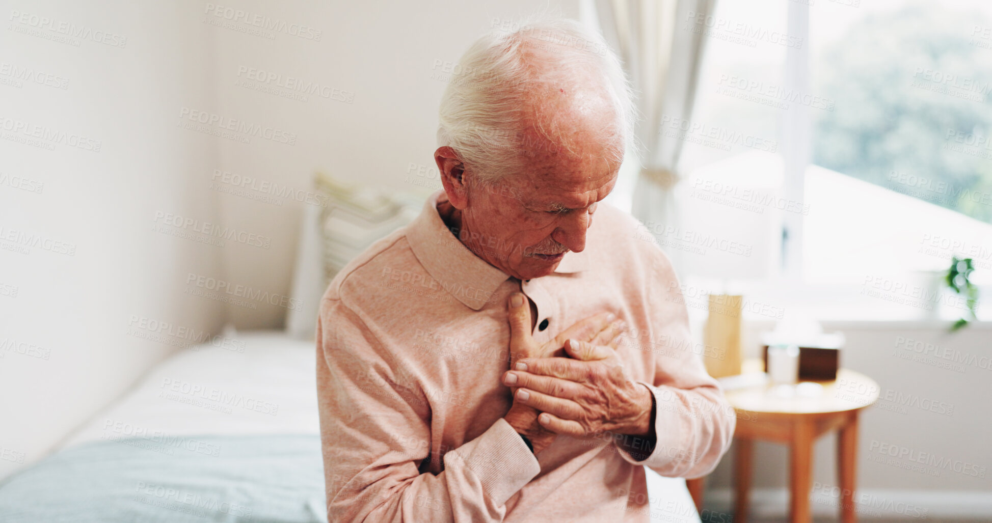 Buy stock photo Senior, man and bed with chest pain for cardiac arrest, heart attack or discomfort in home. Elderly, male person or tension with ache for chronic stress, disease or hypertension in bedroom or house