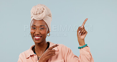 Buy stock photo Portrait, promotion and woman with smile, point and advertising options for discount deal in studio. White background, space and black person with recommendation, happy and presentation with gesture