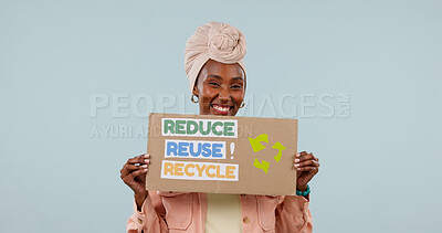 Buy stock photo Poster, portrait and black woman in studio for recycling, go green and support for climate change. Happy, space and person with mockup sign for environmental care, sustainability and blue background