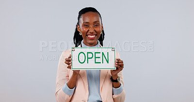 Buy stock photo Happy, space and portrait of black woman with open sign in studio for welcome, advertising or marketing. Smile, poster and corporate employee with board for service announcement on white background.