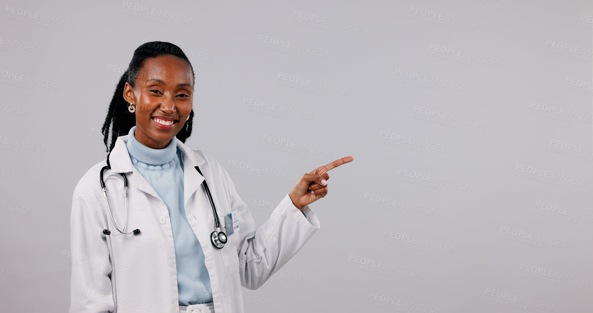 Buy stock photo Pointing, space and portrait of doctor in studio for medical service, health support and mockup. Healthcare, happy and black woman with announcement for medicare, wellness or news on white background