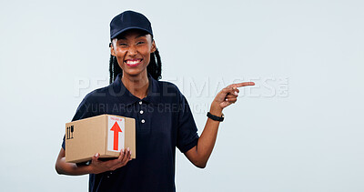 Buy stock photo Pointing, portrait and woman in studio for delivery, shipping and info space for courier service. Mockup, happy and African person with box for ecommerce, logistics or advertising on white background