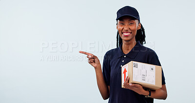 Buy stock photo Pointing, delivery and portrait of woman with space for shipping, courier service and ecommerce info. Mockup, happy and black person with box for supply chain, logistics and news on studio background