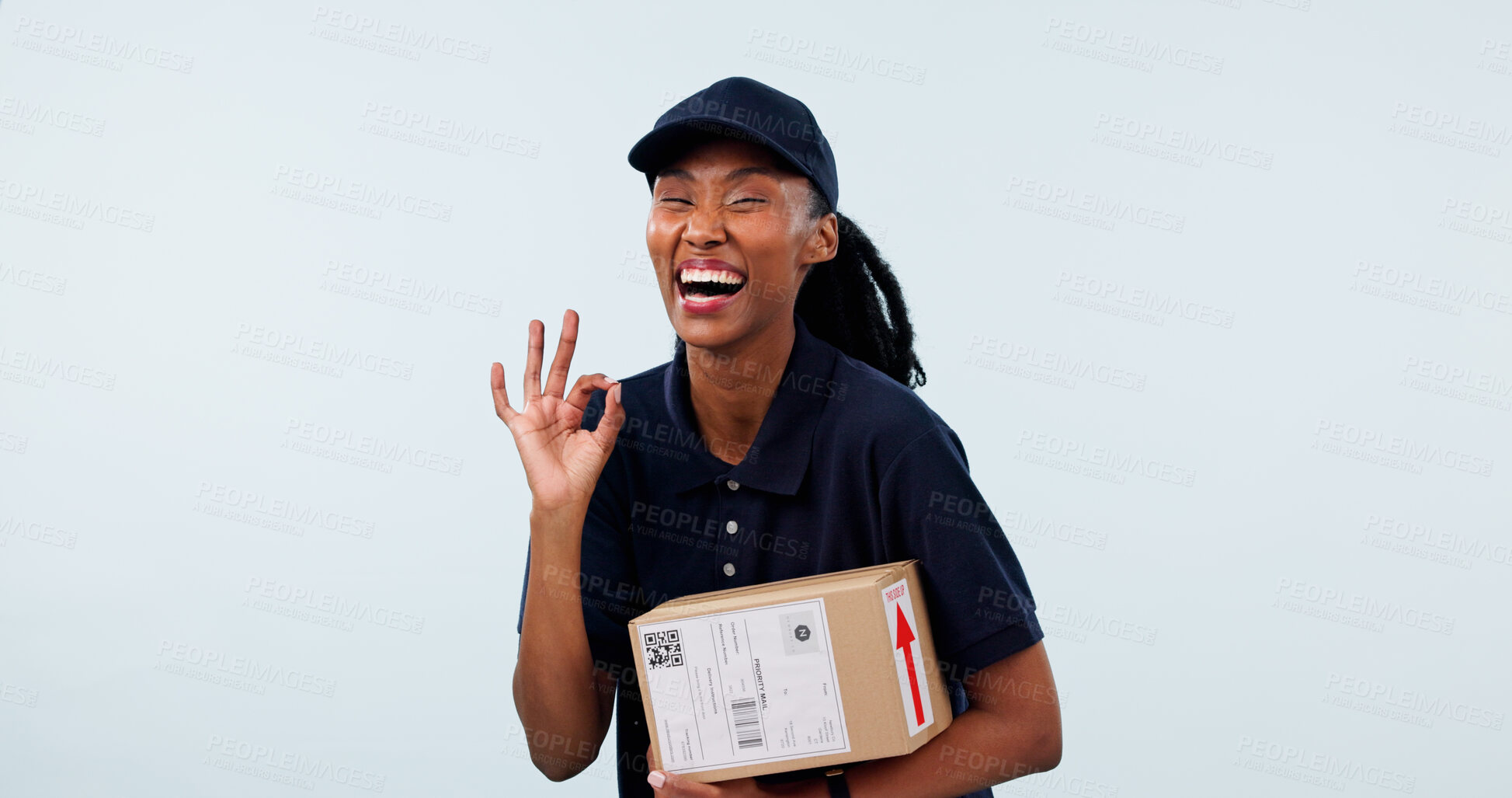 Buy stock photo Box, black woman and portrait of logistics worker in studio by space for distribution, delivery or cargo. Happy, package and courier with great hand gesture for cardboard parcel on white background.