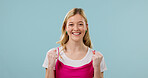 Fist pump, excited and smile with portrait of woman in studio for deal, success and good news. Happy, announcement and prize giveaway with person on blue background for winner, promotion and space