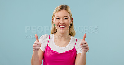 Buy stock photo Laugh, woman and thumbs up in studio for agreement, feedback or support on blue background. Funny person, like hand gesture and portrait with happiness, thank you and recommendation with space