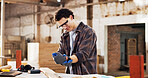 Carpentry, workshop and man with wrist pain for accident, woodworking injury and carpal tunnel. Carpenter, warehouse and person with strain, inflammation and hurt for pressure, overworked and stress