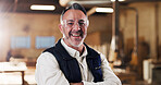 Carpentry, portrait or man in warehouse with arms crossed, craftsman or pride in furniture business. Happy, flare or mature carpenter with confidence, woodworking or about us as lumber contractor.