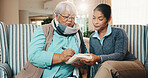 Caregiver, old woman and writing at house with book, word search and crossword for healthcare. Nurse, help and senior person in home with sudoku, problem solving and puzzle activity for brain teaser