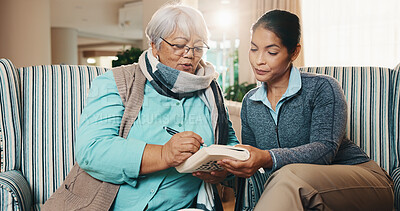 Buy stock photo Caregiver, old woman and writing at house with book, word search and crossword for healthcare. Nurse, help and senior person in home with sudoku, problem solving and puzzle activity for brain teaser