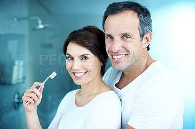 Buy stock photo Couple, hug and toothbrush with portrait for dental care, grooming and morning routine in home. Man, woman and smile for brushing teeth, love and wellness with cleaning or happiness in house bathroom