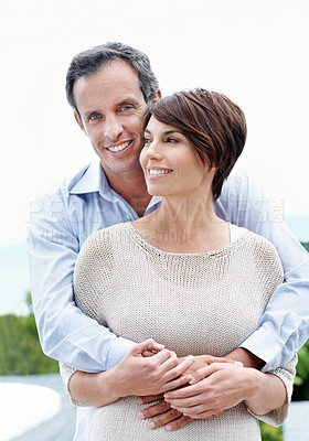Buy stock photo Happy, hug and couple with love outdoor, loyalty and relationship commitment on vacation. Smile, mature man and woman embrace in nature for support, care and trust on holiday with portrait of partner