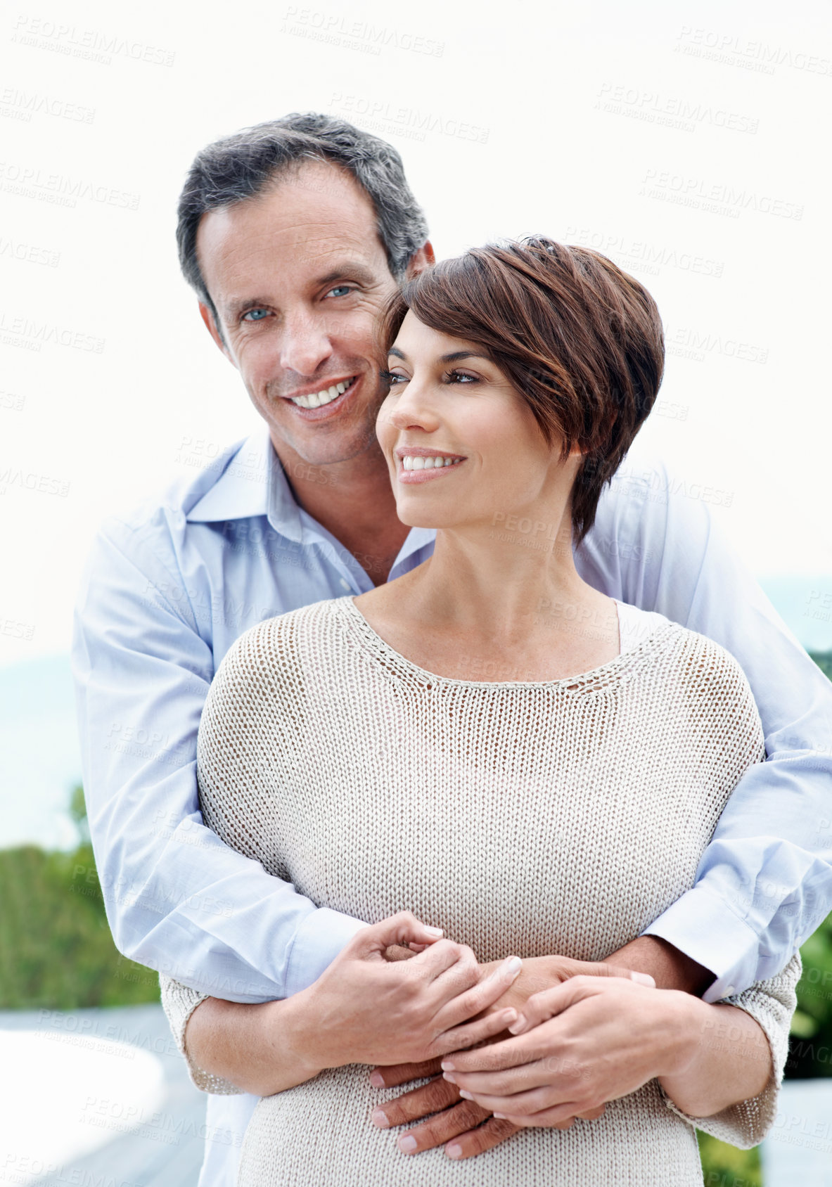 Buy stock photo Happy, hug and couple with love outdoor, loyalty and relationship commitment on vacation. Smile, mature man and woman embrace in nature for support, care and trust on holiday with portrait of partner