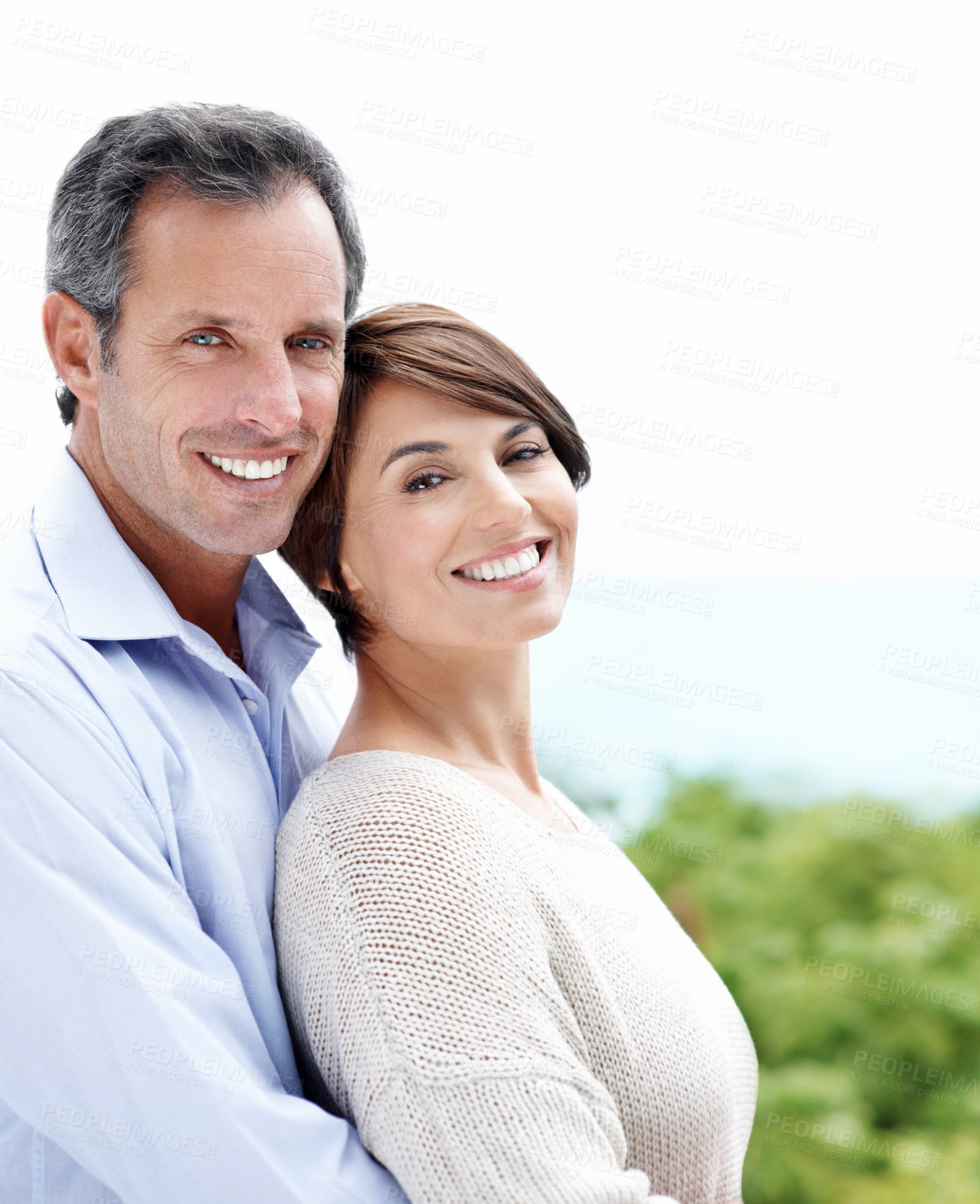 Buy stock photo Smile, portrait and couple with care in nature, loyalty or relationship commitment on vacation. Happy, mature man and woman with connection by ocean for love, trust or bonding on holiday with partner