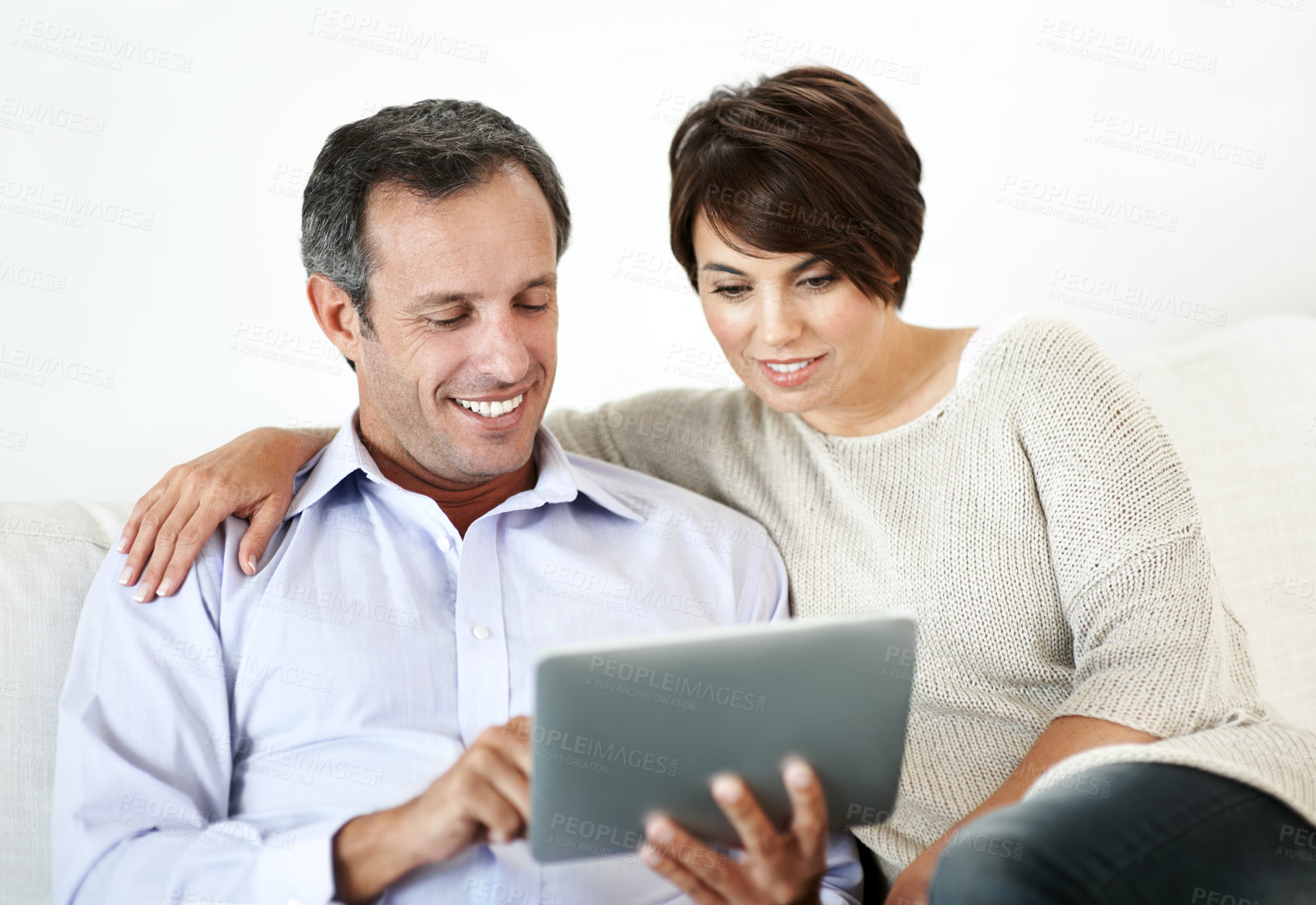 Buy stock photo Relax, sofa and happy couple with tablet for website, online browsing or entertainment together. Man, woman or smile with technology on couch for streaming app, subscription or network service