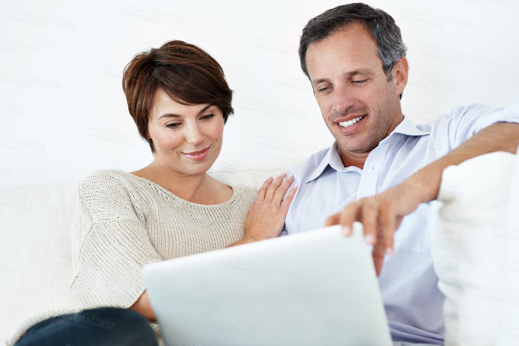 Buy stock photo Couple, laptop and happy with reading on home sofa for online connection, browsing and internet. Man, woman and technology in house living room for streaming, subscription or planning on website