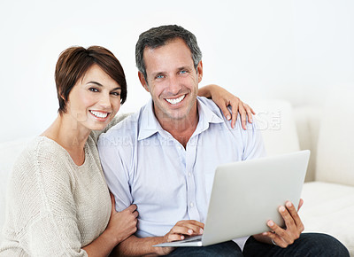Buy stock photo Couple, laptop and happy with portrait on home sofa for online connection, browsing and internet. Mature man, woman and tech in house living room for streaming, subscription or planning on website