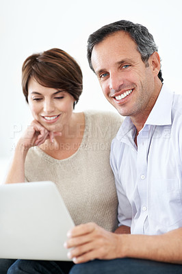 Buy stock photo Laptop, network or happy couple in studio for entertainment or online subscription on a white background. Man, woman or smile with technology for streaming service, web platform or digital connection
