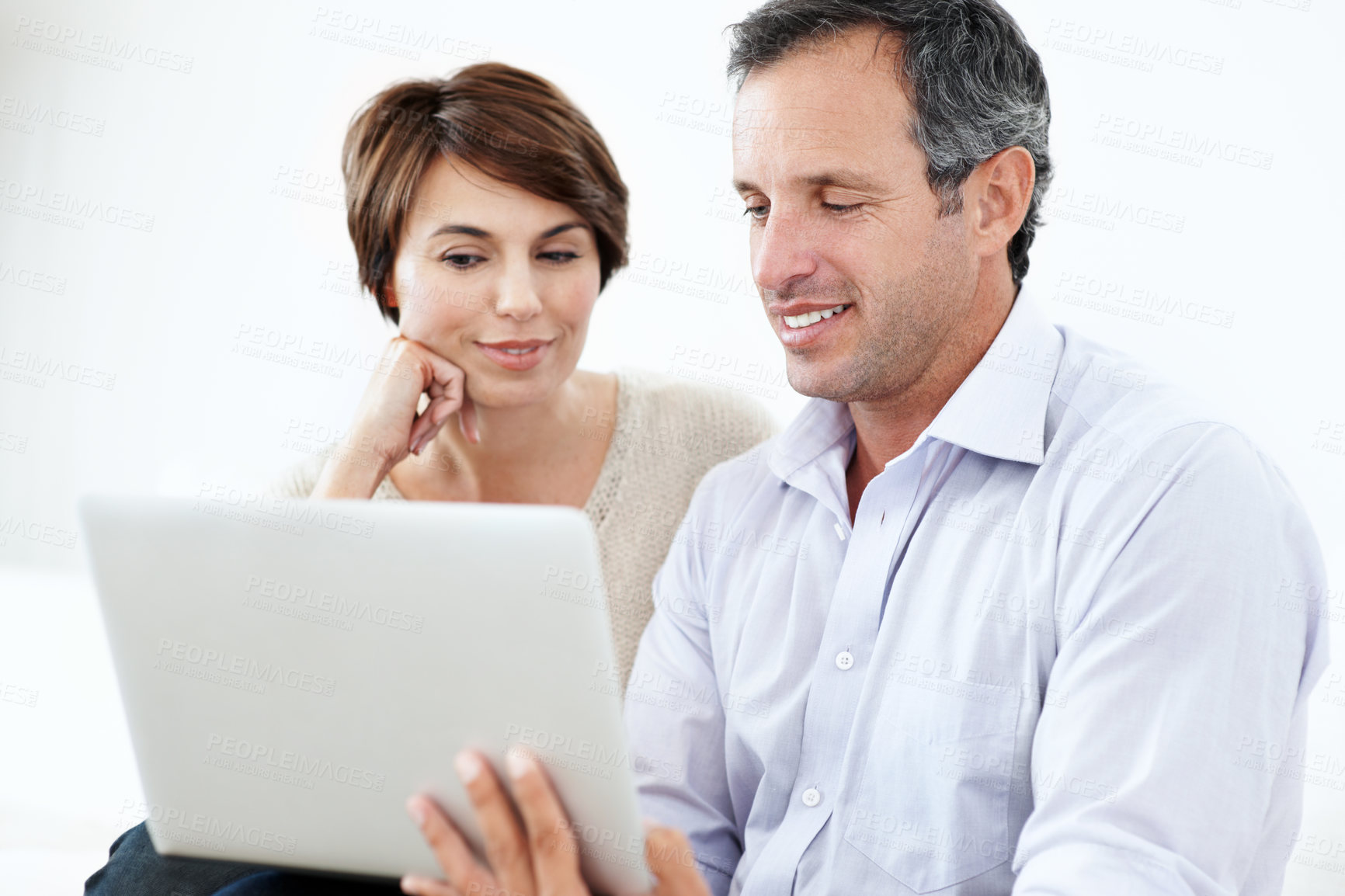 Buy stock photo Relax, couple and happy with laptop in home for movie website, film selection and weekend break. Bonding, mature man and woman with tech in house for series subscription, search tv show and support