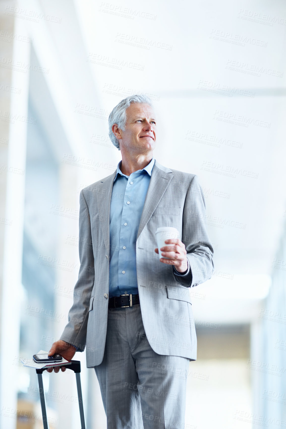 Buy stock photo Businessman, travel and suitcase in airport with coffee, international trip or arrival for conference. Low angle, space and mature person journey with luggage, drink or thinking for global convention