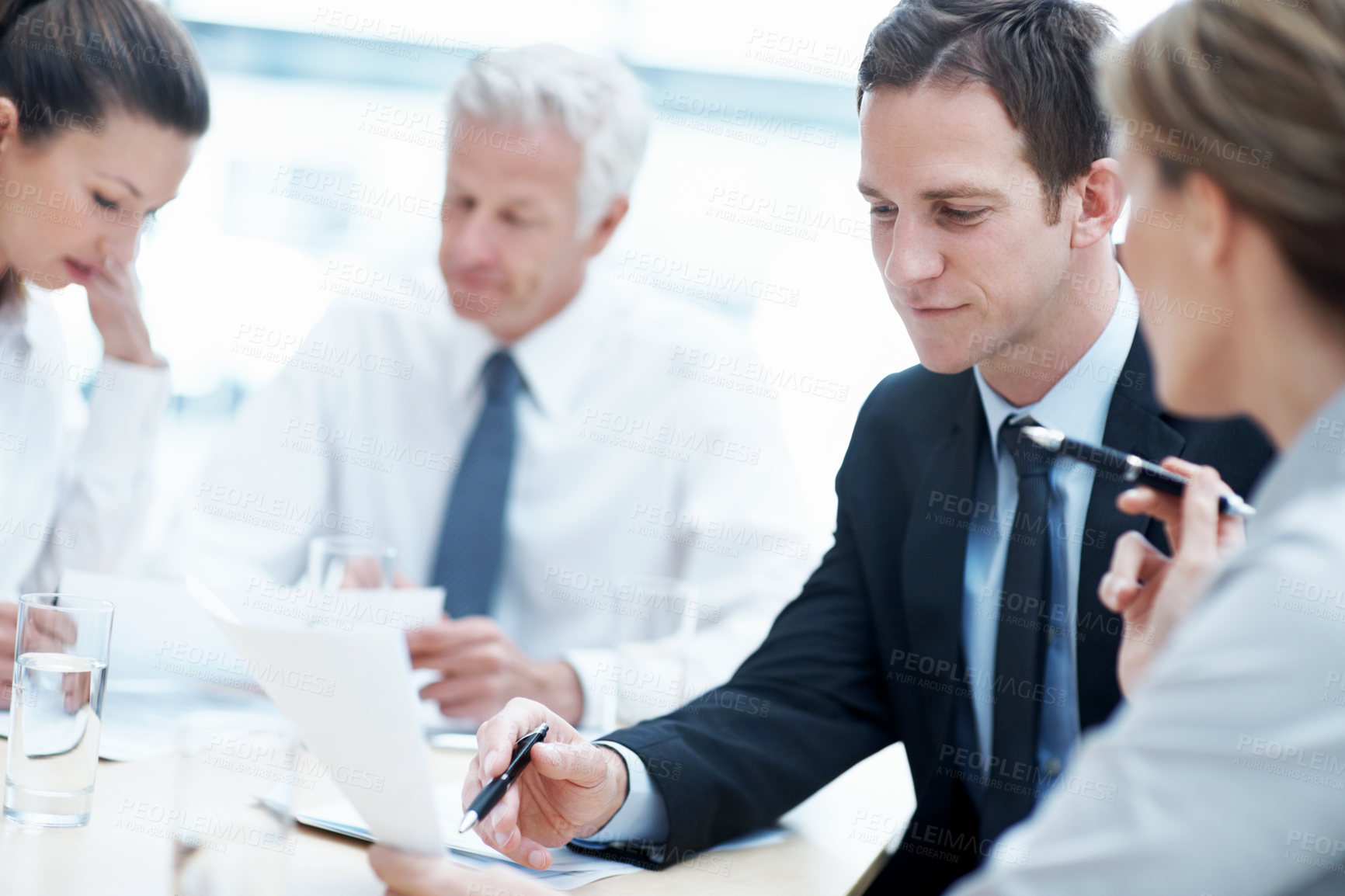 Buy stock photo Business, meeting or people in office with paper, strategy insight or feedback in budget review. Collaboration, brief or finance team with document, funding evaluation or forecast in revenue report.