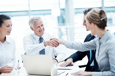 Buy stock photo Handshake, meeting and business people in office for partnership, agreement or finance negotiation. Laptop, discussion and financial advisor shaking hands with investor for deal, contract or offer.