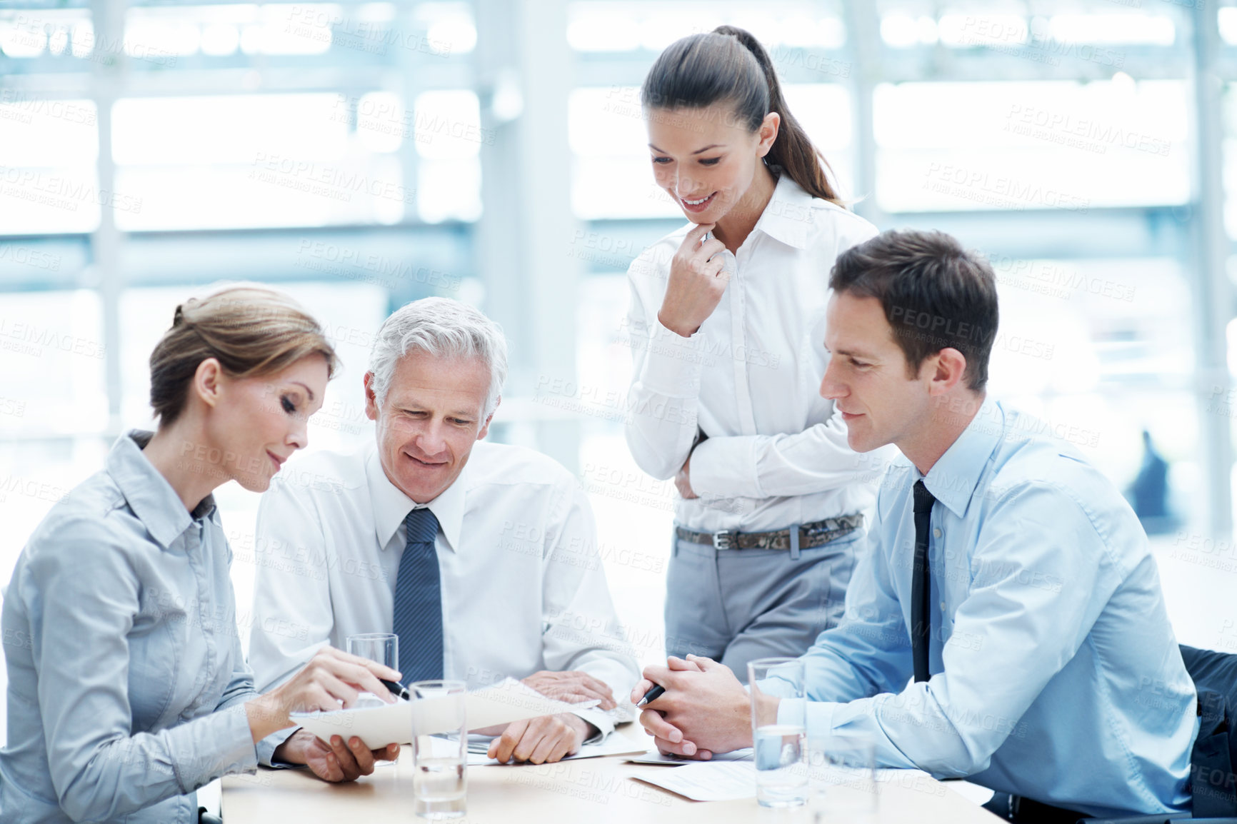 Buy stock photo Business, meeting or people in agency with paper, strategy insight or feedback in budget review. Collaboration, brief or finance team with document, funding evaluation or forecast in revenue report.