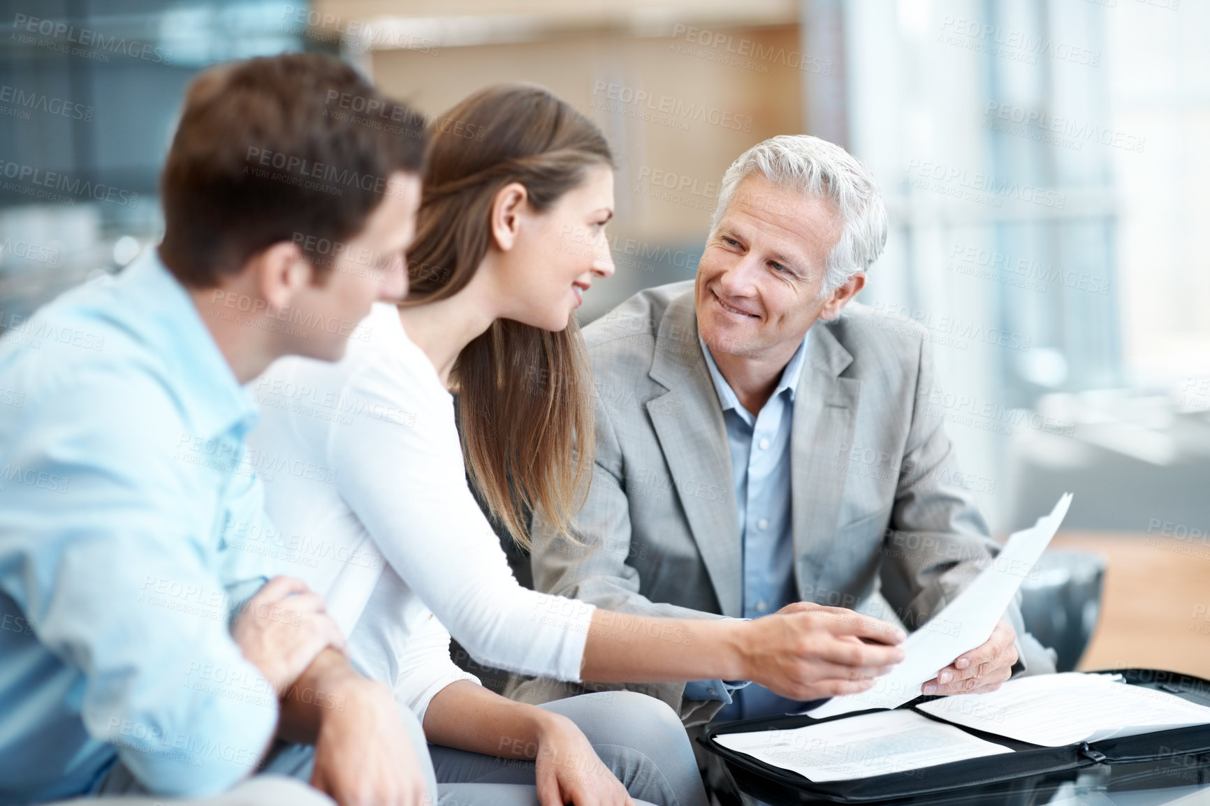 Buy stock photo Couple, meeting and advisor in office with document, contract and finance report for funding. Smile, people and lawyer in workplace with paperwork, review budget and loan application for investment