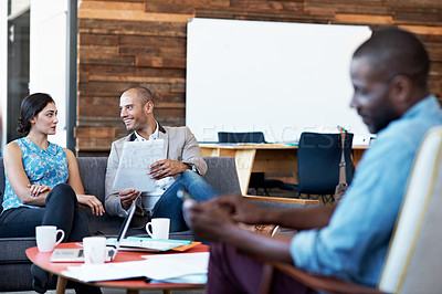 Buy stock photo Shot of a group of colleagues working in an office