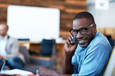 Buy stock photo Portrait of an office worker talking on his cellphone