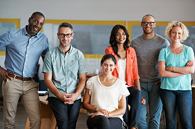 Buy stock photo Portrait of a diverse group of coworkers standing together in an office