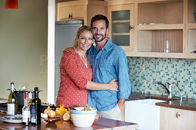 Buy stock photo Cropped portrait of a couple cooking in the kitchen