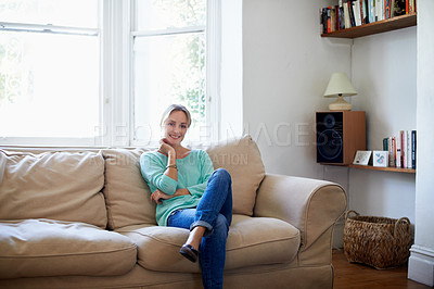 Buy stock photo Portrait of a young woman relaxing at home