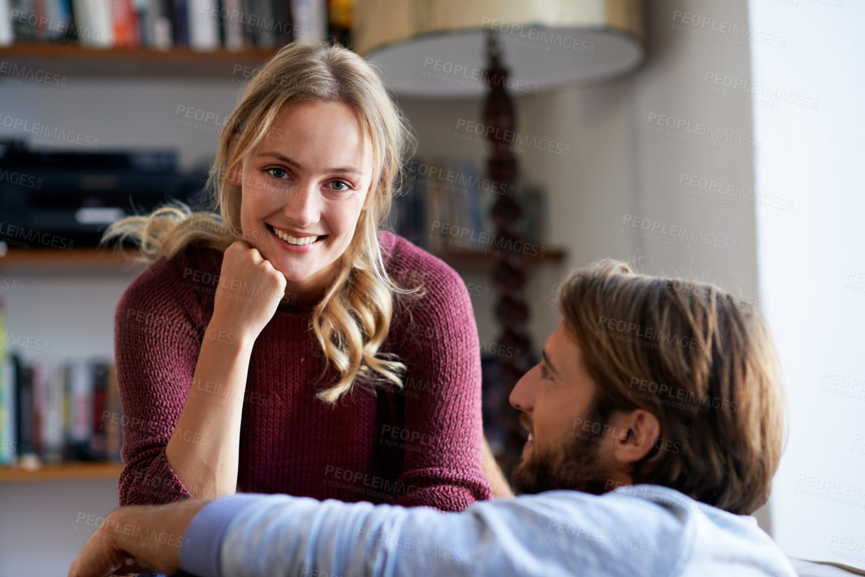 Buy stock photo Couple, bonding and happy woman on break in house, portrait or chilling with partner in living room. People, support and smile with spouse in lounge, resting and relationship commitment in home