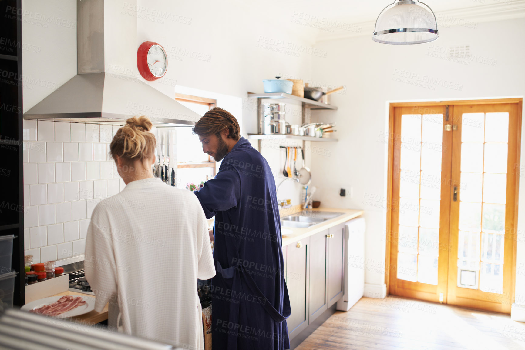 Buy stock photo Couple, cooking or help in kitchen with breakfast, pajamas or healthy nutrition for wellness at home. People, dating and morning routine in apartment with meal preparation, food and recipe for diet
