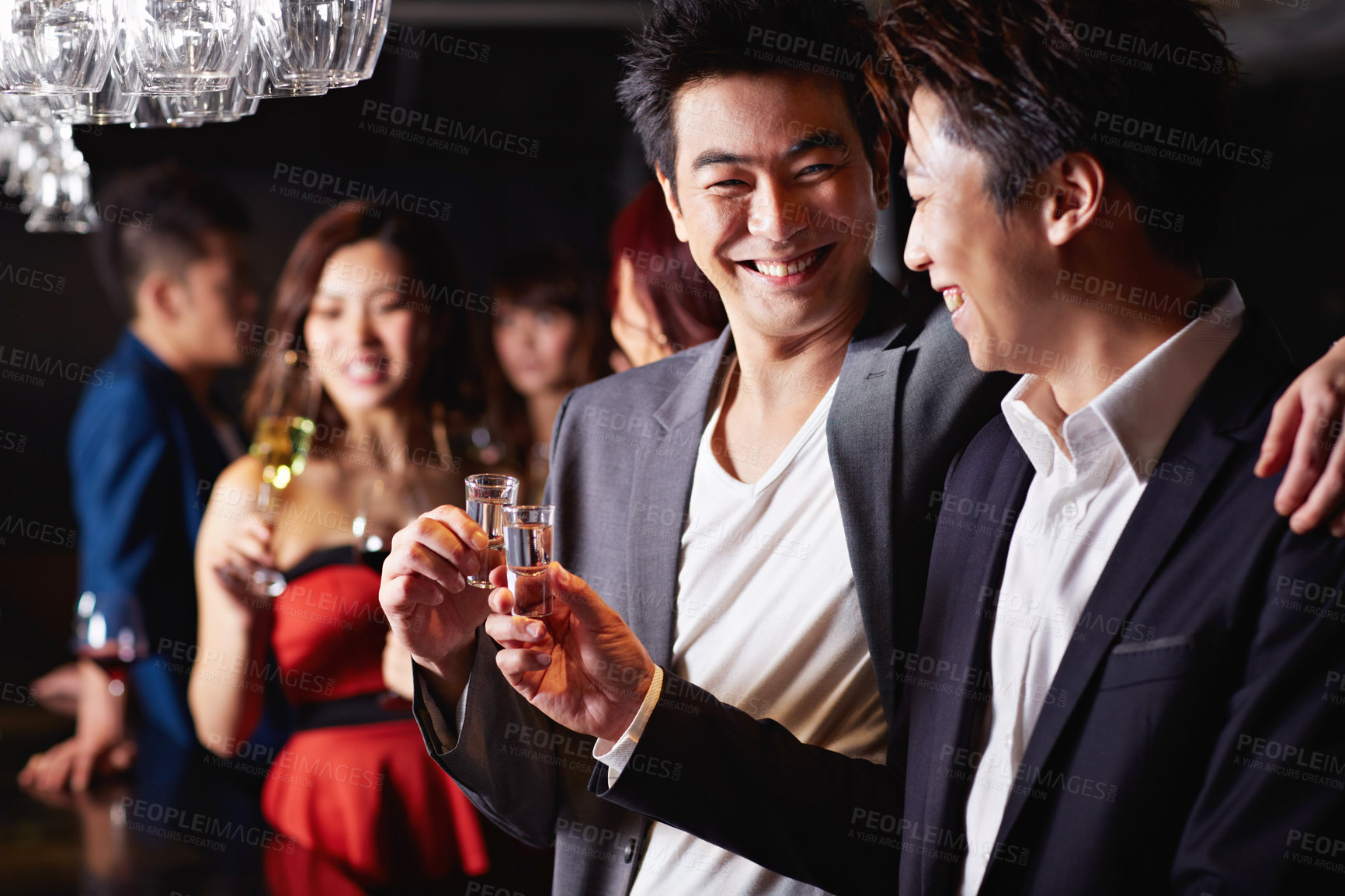 Buy stock photo Cheers, party and shot with asian people at club for social gathering, music festival and event. Celebration, weekend break and mixer with friends at night for new years eve, disco and toast