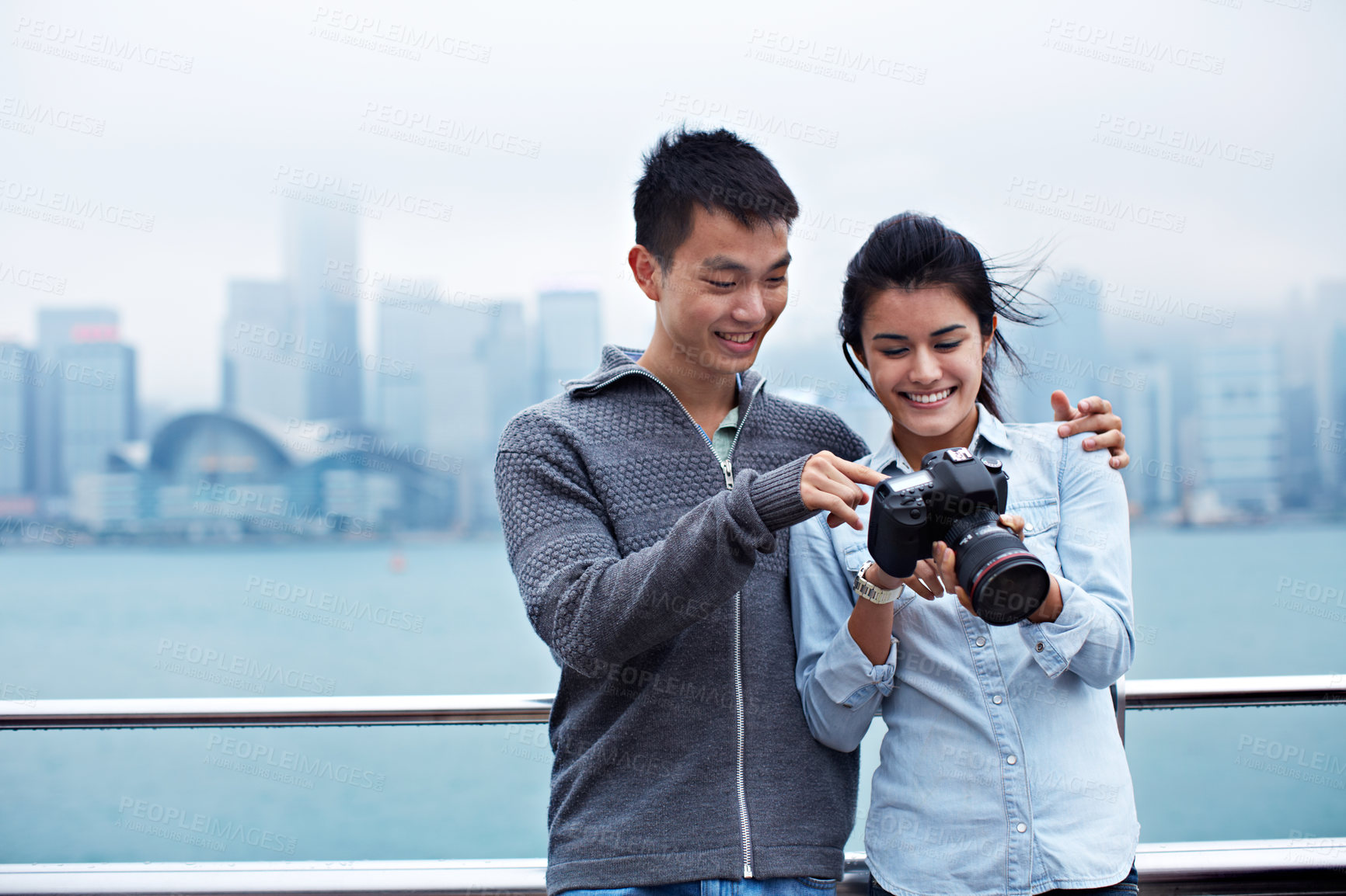 Buy stock photo Holiday, couple and check camera in city for picture quality, sightseeing memory or travel abroad. Tourism, asian people and happy with lens outdoor for photo results, image review or bonding on trip