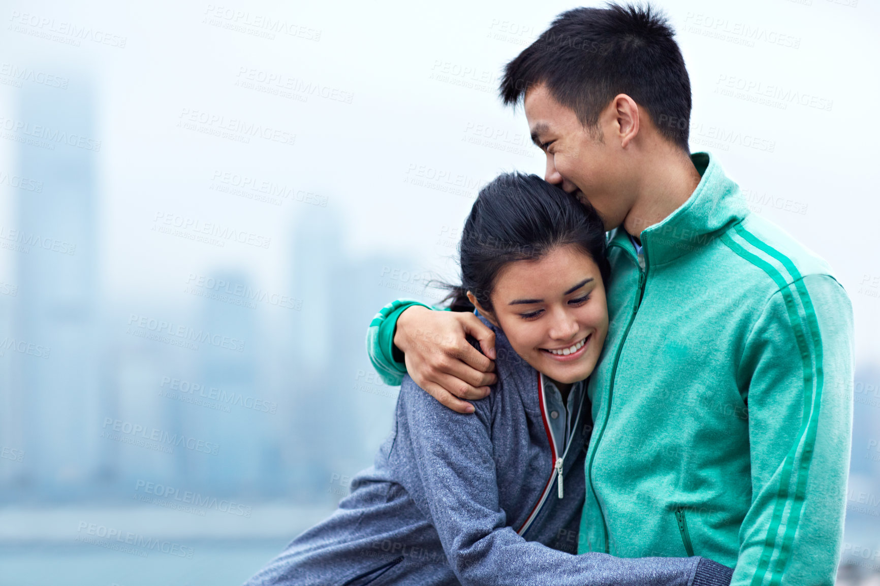 Buy stock photo Hug, happy and Asian couple in city for fitness, exercise and bonding with wellness goals outdoor. Space, dating and man with woman embrace for health, love and training together in Hong Kong