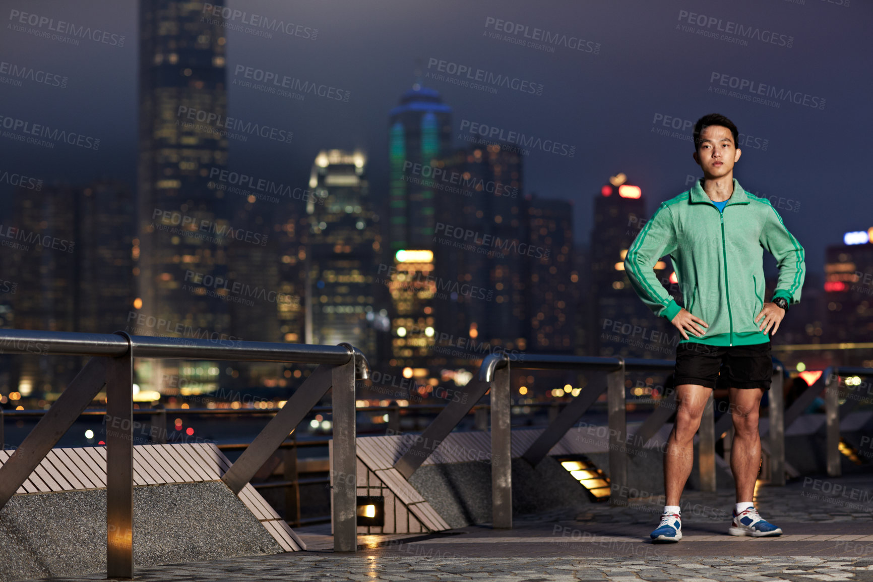 Buy stock photo Fitness, portrait and Asian man in city at night for exercise, cardio workout and runner challenge. Confident, space and person outdoor for training, wellness and active for health in Hong Kong
