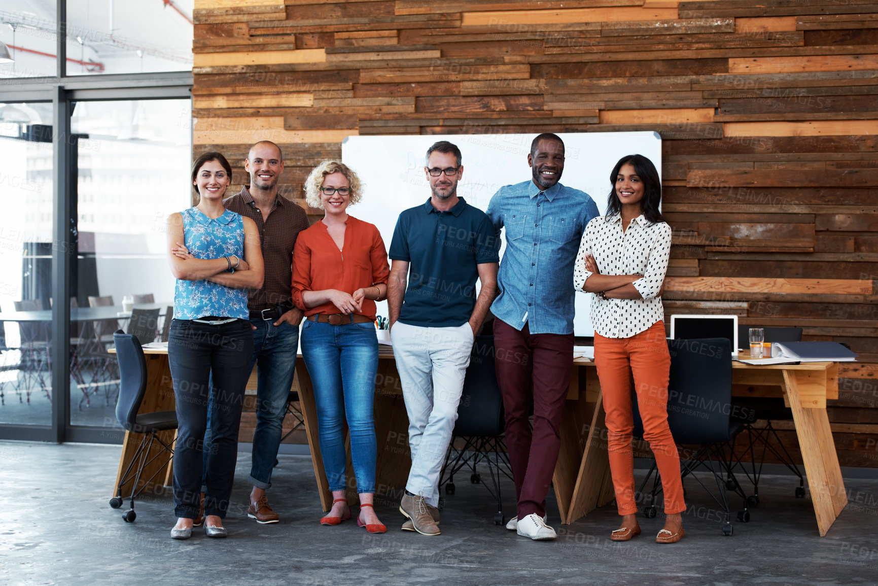 Buy stock photo Portrait of a group of coworkers standing together in an office