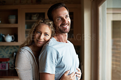 Buy stock photo Cropped shot of an affectionate couple in the kitchen