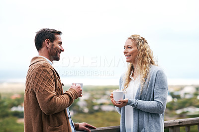 Buy stock photo Cropped shot of a couple talking outside on their deck