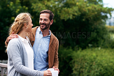 Buy stock photo Cropped shot of a couple talking outside on their deck