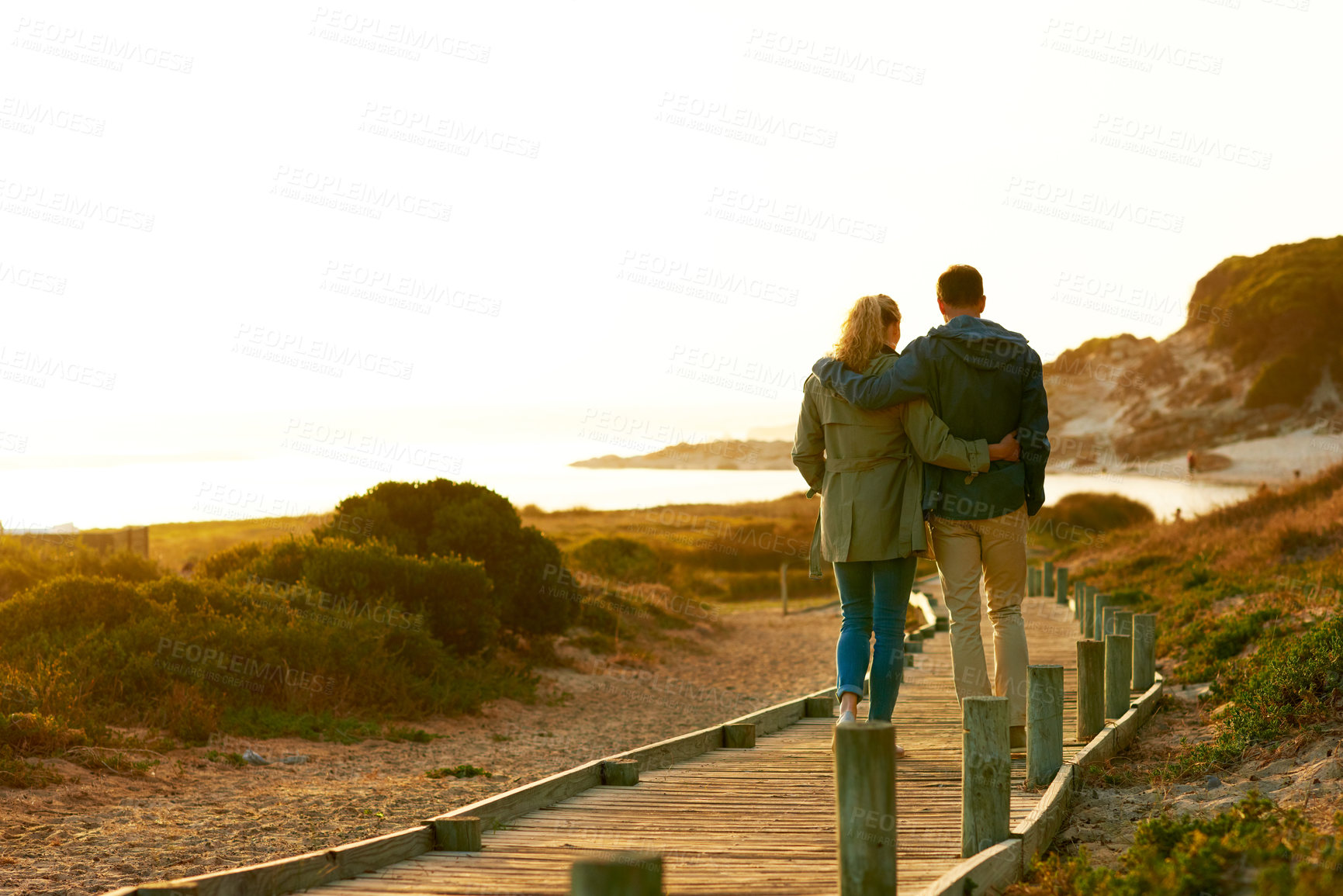 Buy stock photo Back, hug and couple in nature for support, date and travel outdoor for commitment. Beach, man and woman with relationship for bonding, together and space with romance and walking on holiday trip